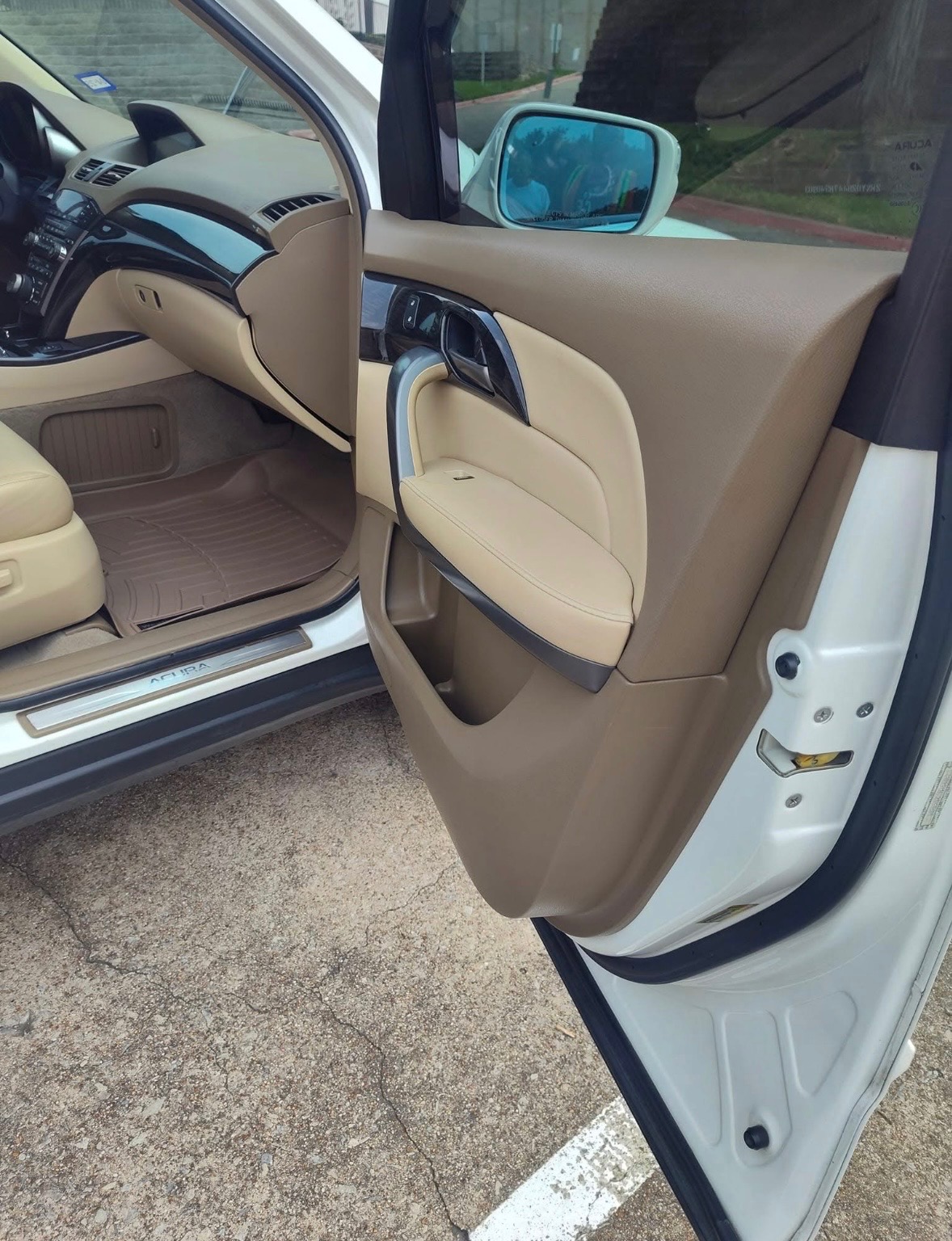 Clean tan Acura interior and passenger door after detailing